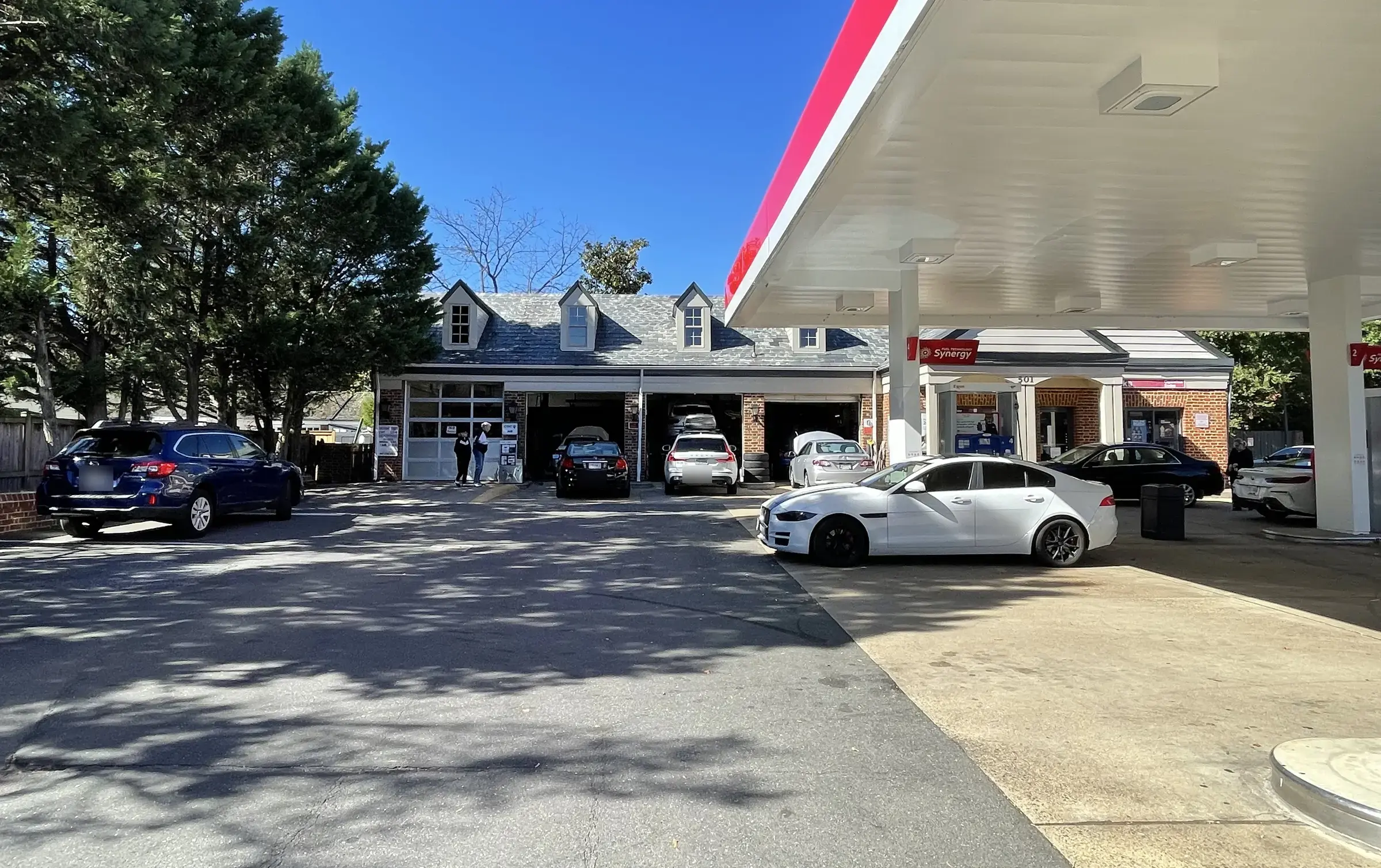 Service bays and Exxon canopy at Old Town Exxon in Alexandria, where we check the car sitting all week with a dead battery