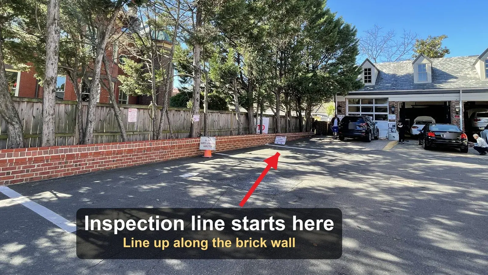 Virginia inspection lane along the brick wall at Old Town Exxon on S. Washington St, where drivers with an expired inspection sticker line up